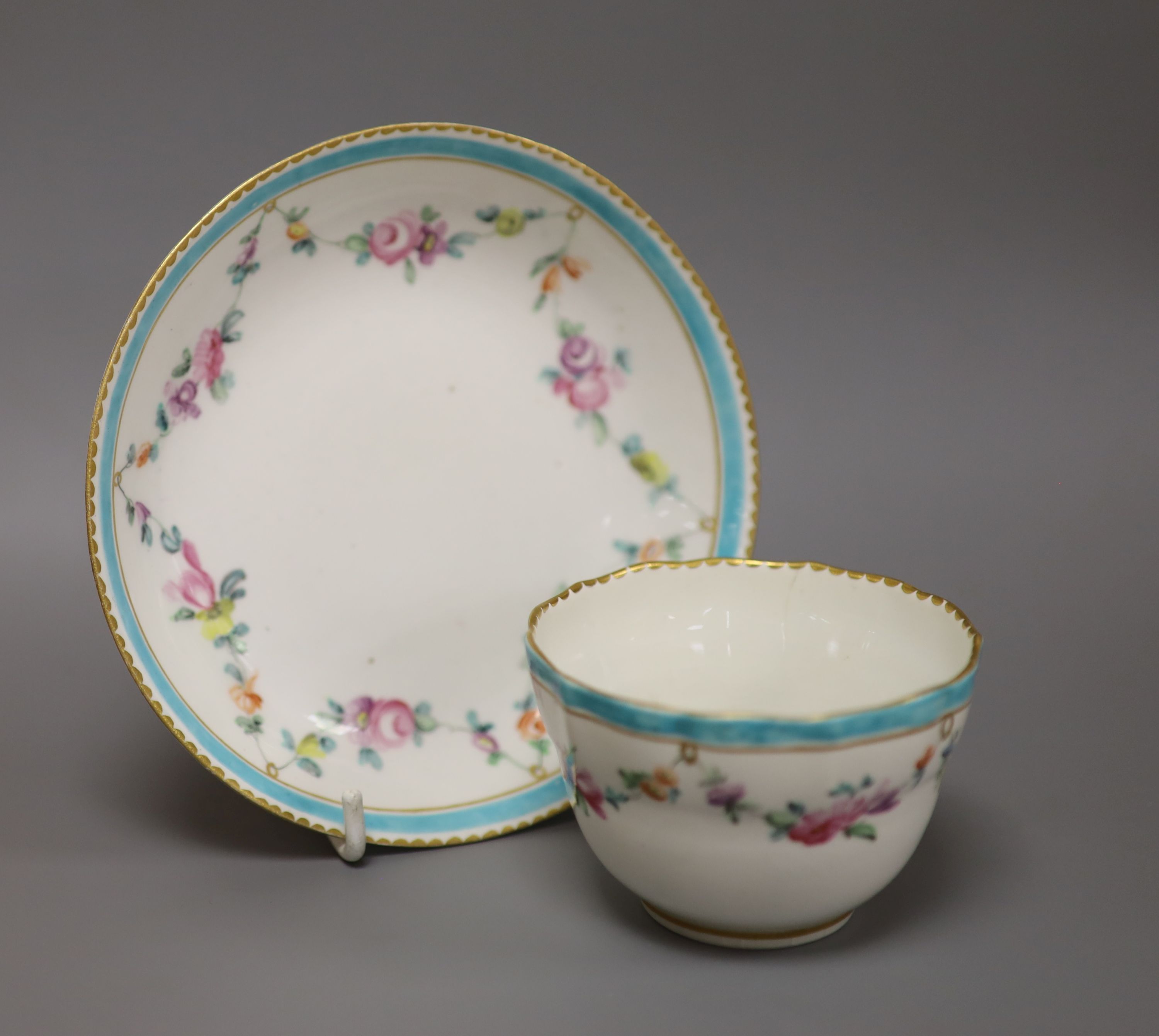 A Chelsea Derby teabowl and saucer painted with flowers, c.1778, blue Crown Derby mark with no batons, diameter 13cm